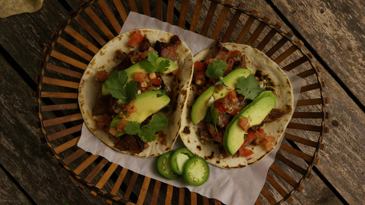 Above view of two tacos with avocado, food, mexico, chicken, avocado, onion, spicy, and cinco de mayo