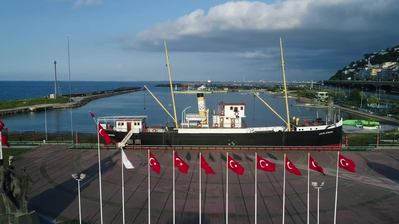 Aerial tour of a port on a turkish coast, boat, coast, ship, and turkey