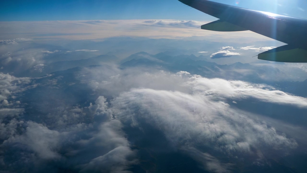 Beautiful view through airplane window #sky #cloudy #window #airplane #fly