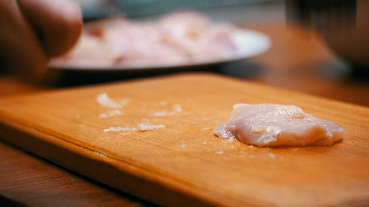 Chef pounding chicken meat on a board, food, food preparation, chef, and chicken