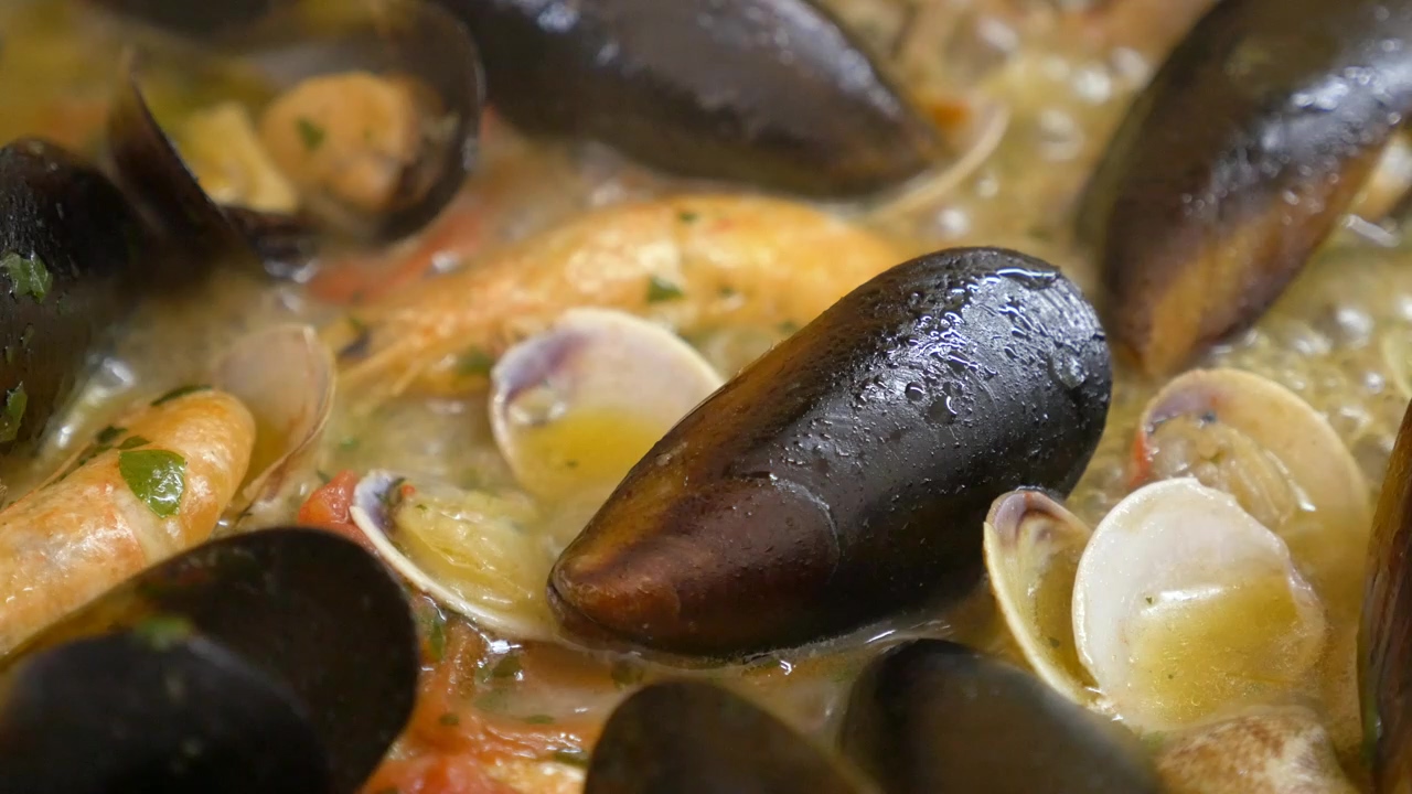 Close up of seafood bubbling away in a pan, food, cooking, fish, cook, meal, and seafood