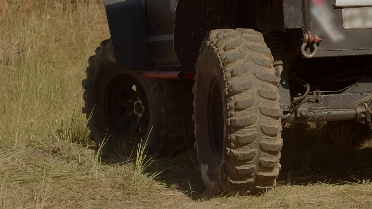 Close up of the tyres of a safari truck, driving, truck, and safari