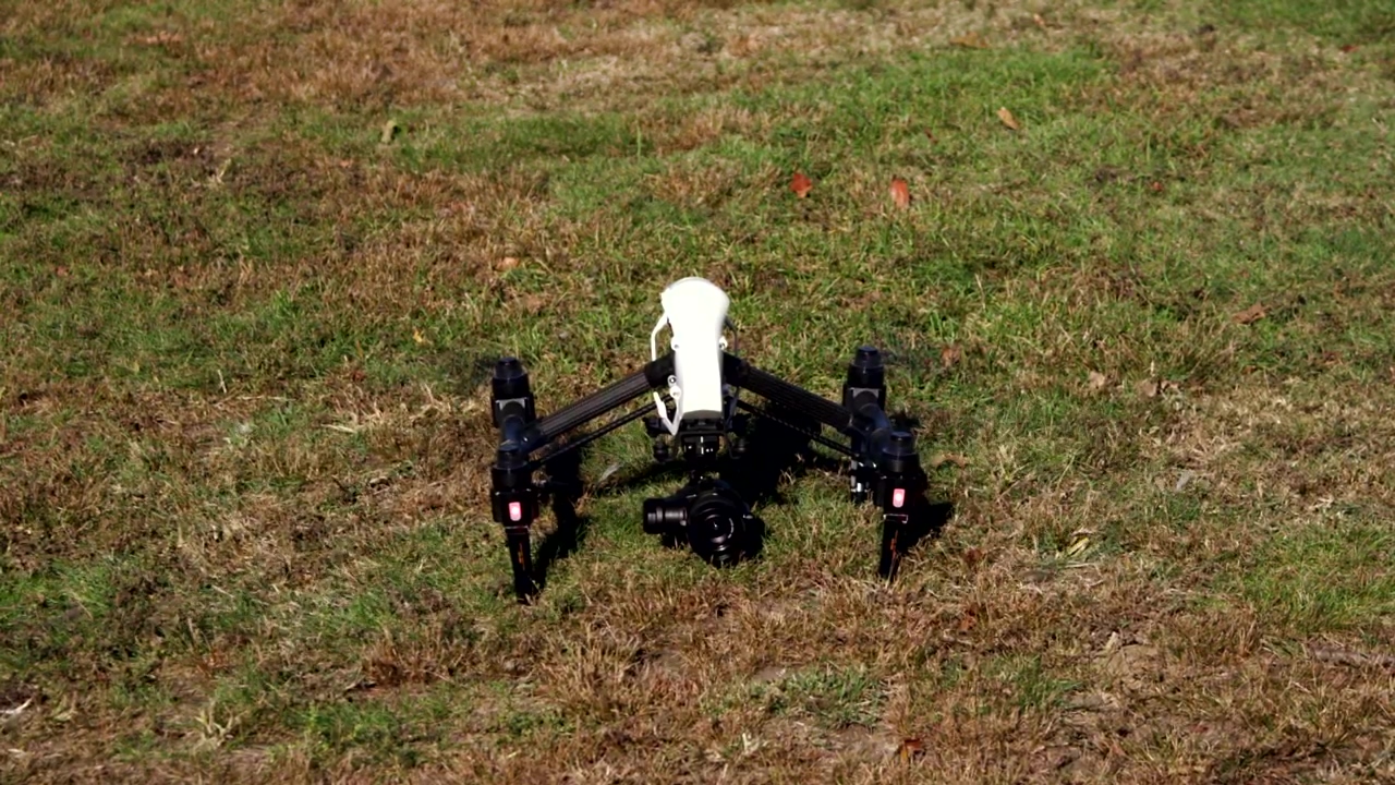 Drone preparing to take off from a park, park, drone, and fly