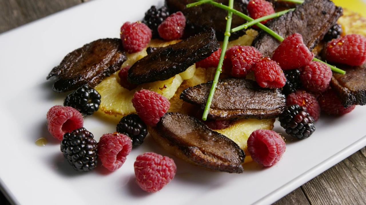 Duck bacon and raspberry dish on white platter #food #fruit #dinner #duck #bacon