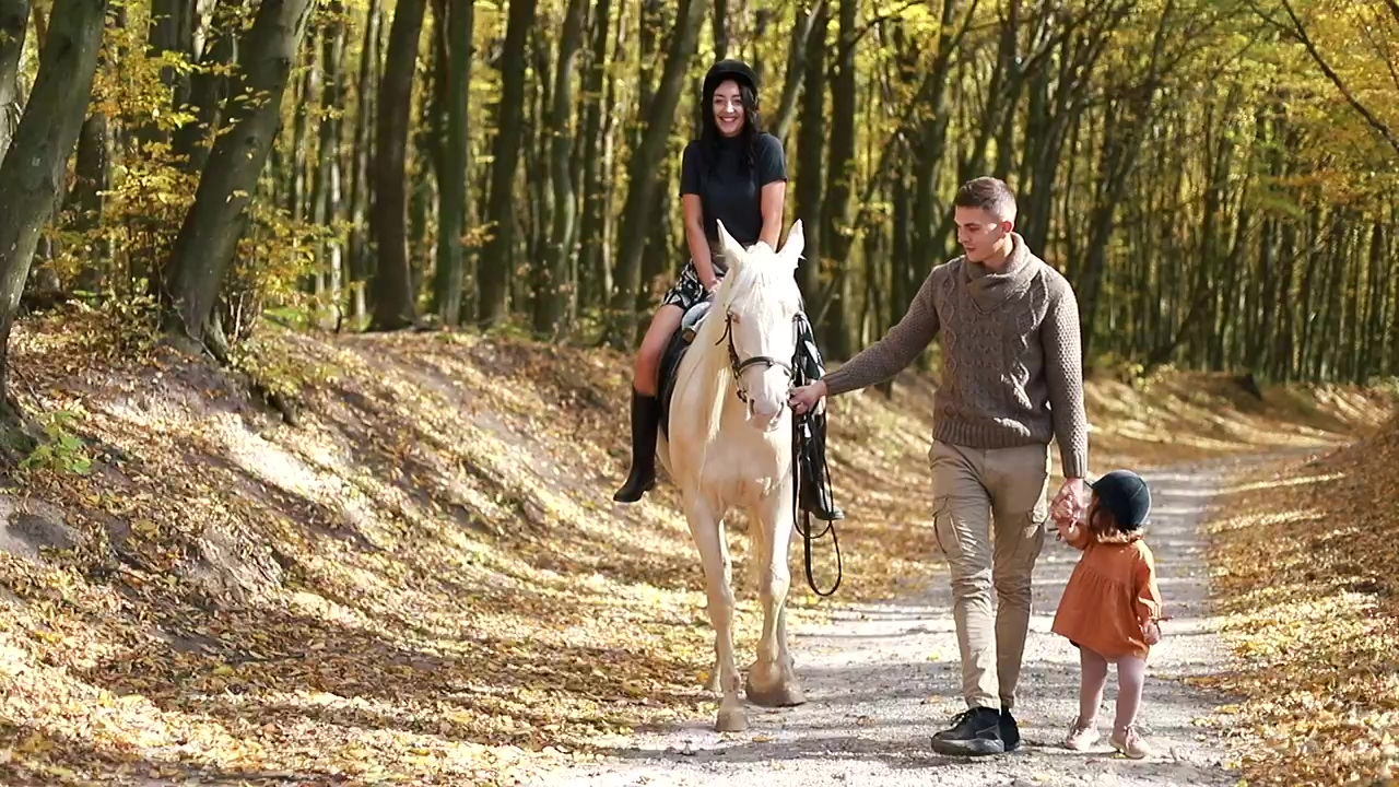 Happy family enjoying an autumn day with their white horse, autumn, happy family, horse, horseback riding, and rides