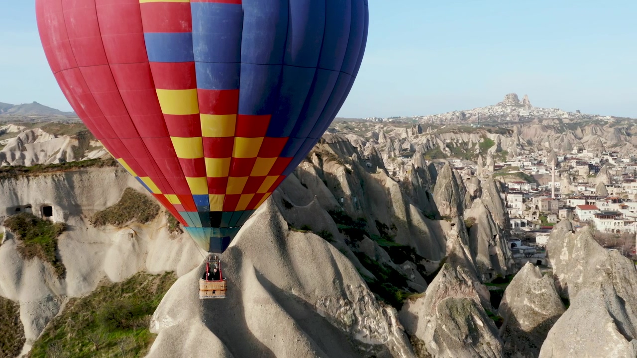 Hot air balloon floats over turkish landscape, travel, turkey, and hot air balloon