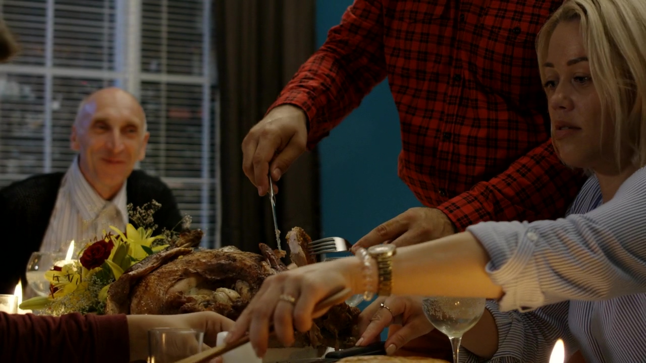 Man carving turkey on thanksgiving dinner, food, celebration, dinner, family dinner, turkey, and thanks giving