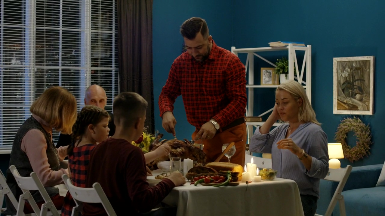 Man serving the turkey for his family #food #family #celebration #eating #home activity #table #family dinner #turkey