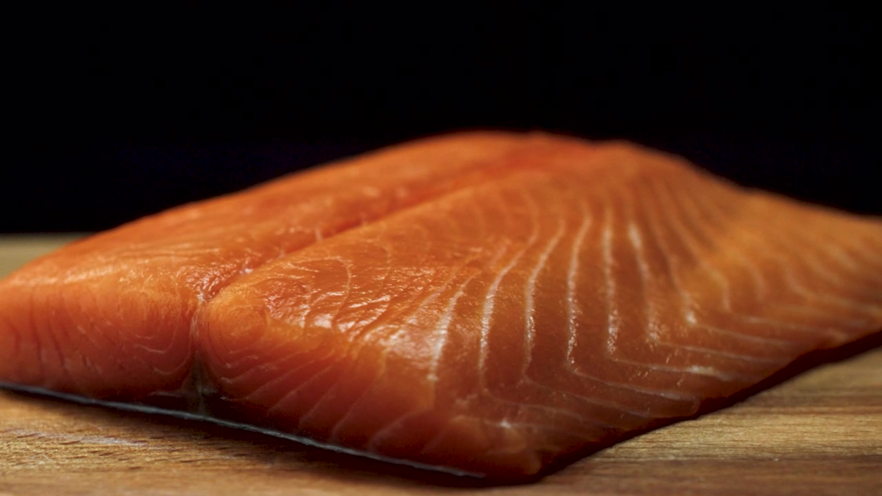 Salmon fillet on a chopping board, food and fish