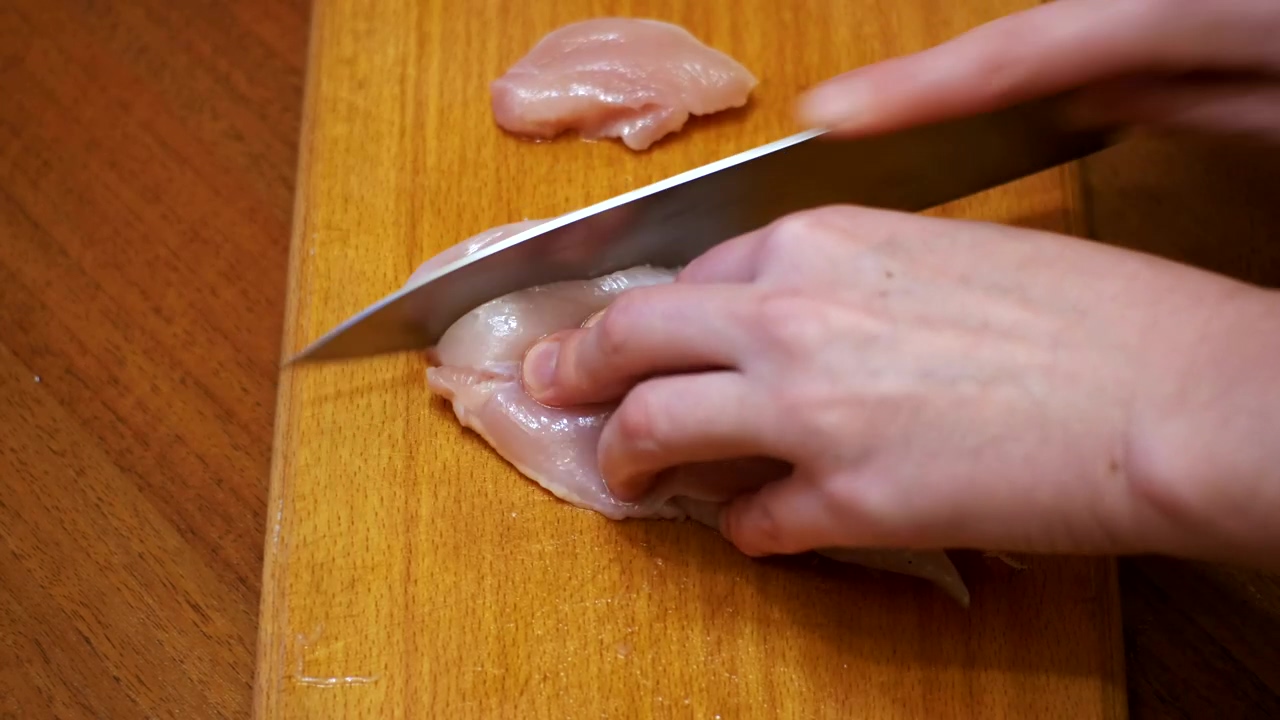 Slicing raw chicken meat, food, food preparation, chef, meat, and chicken