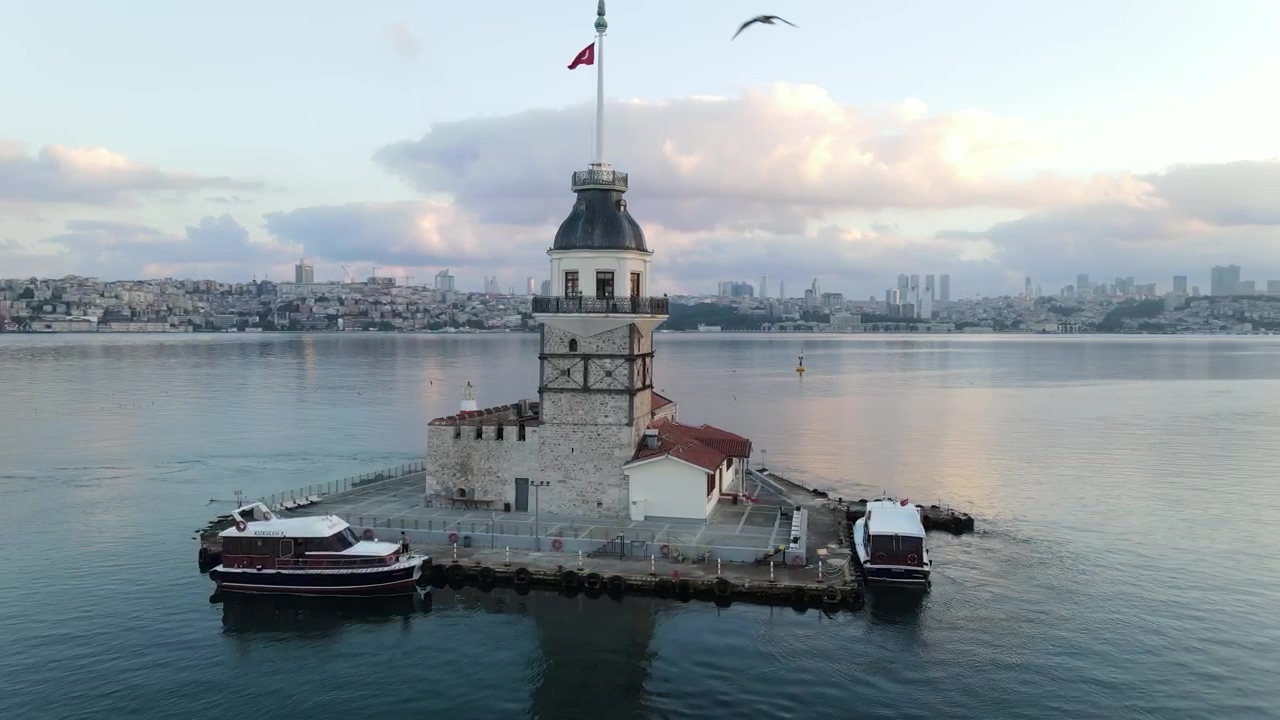 Spinning aerial shot of maiden tower, tourism, tower, turkey, and turkish flag