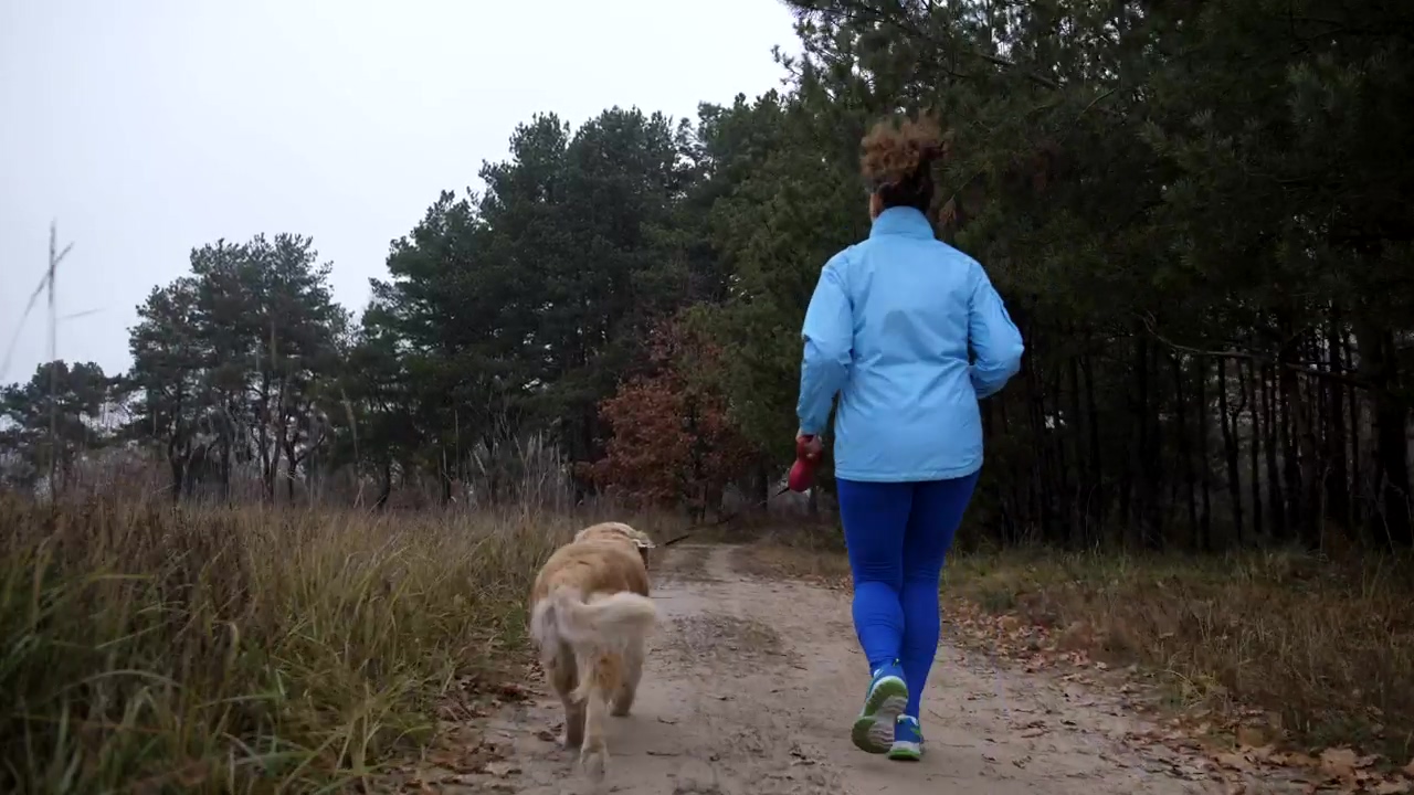 Woman and her dog running down a path, countryside, dog, and running