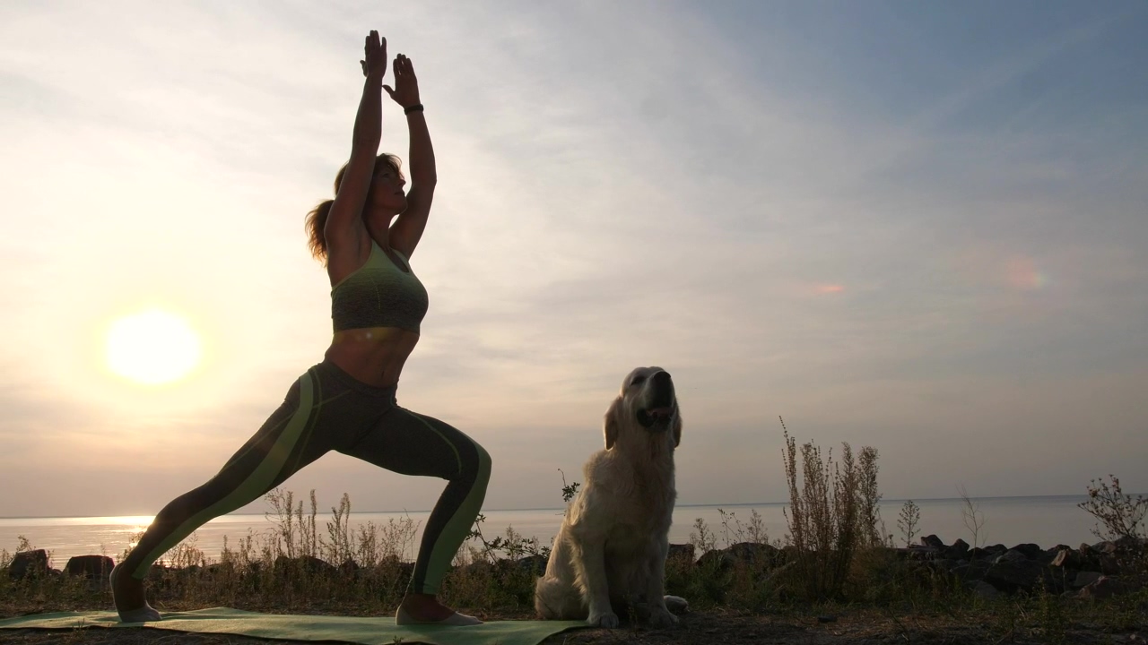 Woman doing yoga at sunset, sunset, dog, and weight loss