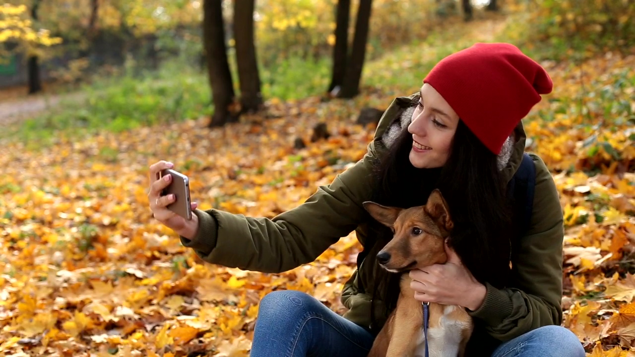 Woman taking a selfie with her dog, dog, selfie, and instagram