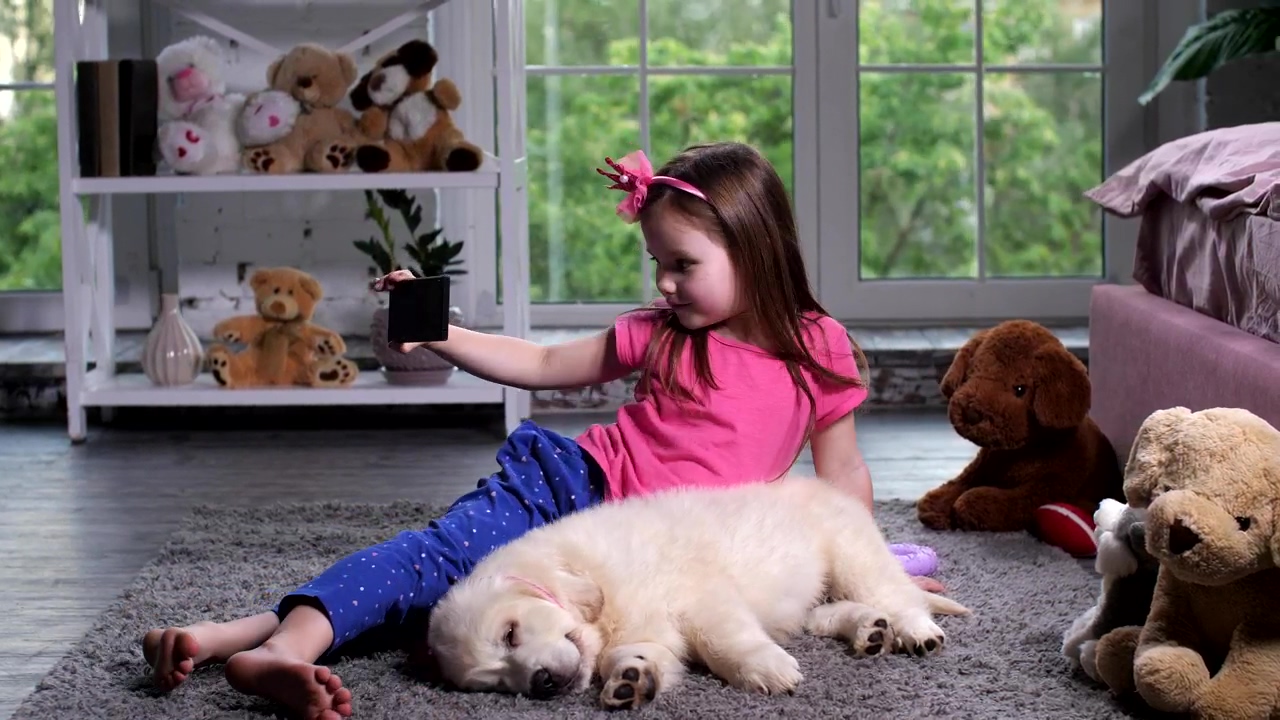 Young child with a puppy taking a selfie, dog, selfie, instagram, and puppy