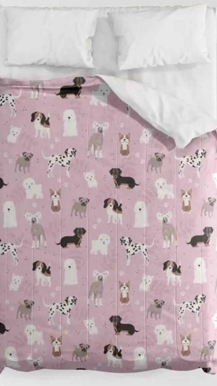 Sweet puppies on pink comforter | fluffy white puppy is having a happy happy day